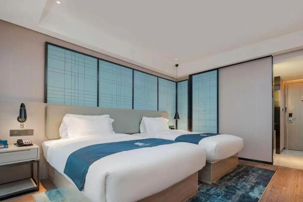 Bed in Echarm Hotel Changsha Wuyi Square Railway Metro Station