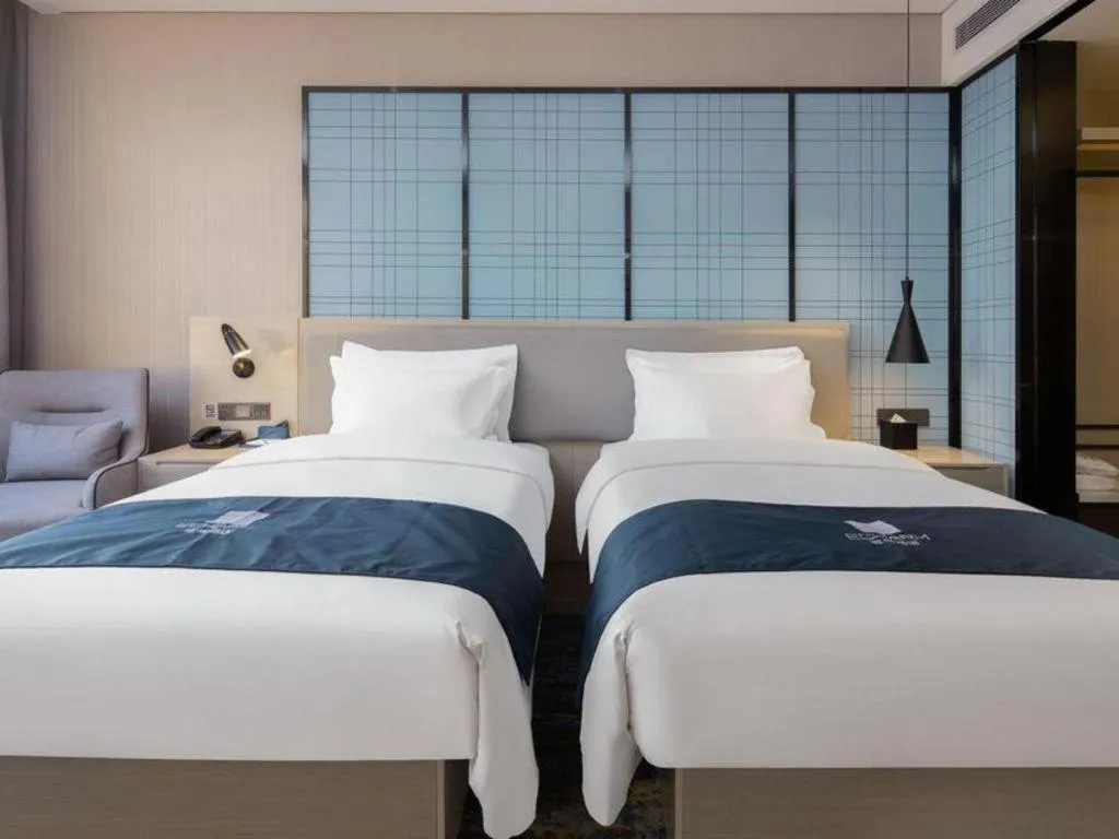 Bed in Echarm Hotel Changsha Wuyi Square Railway Metro Station