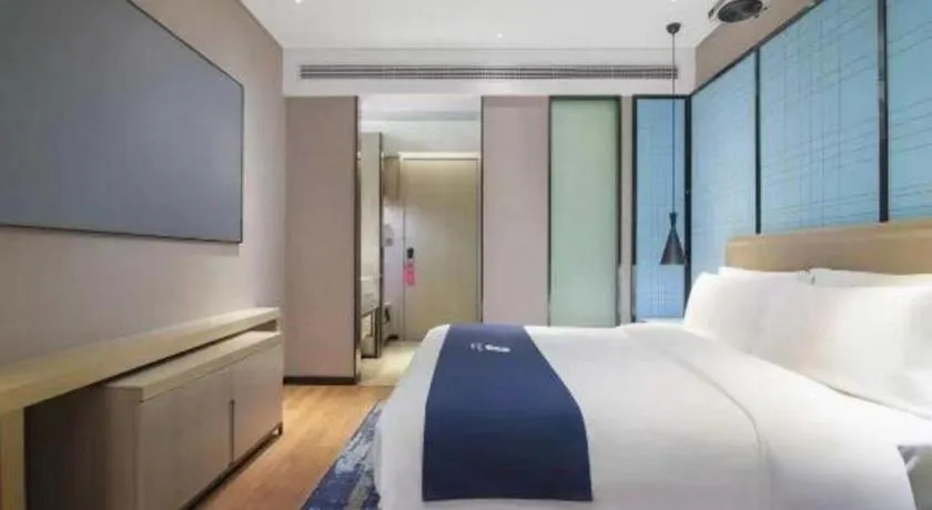 Bed in Echarm Hotel Changsha Wuyi Square Railway Metro Station