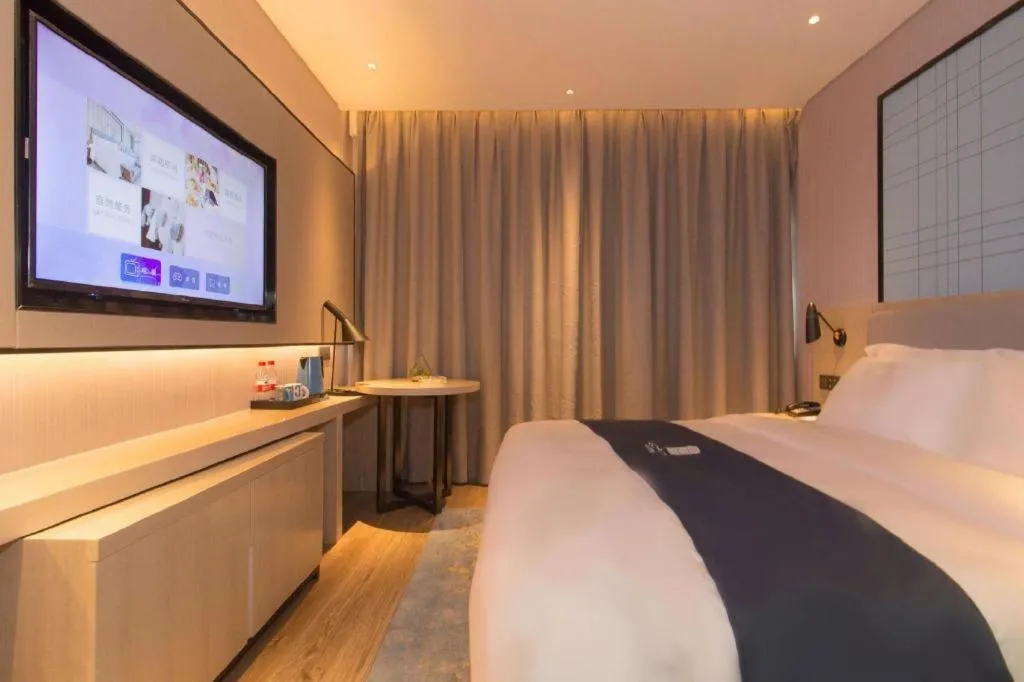 Bed in Echarm Hotel Changsha Wuyi Square Railway Metro Station