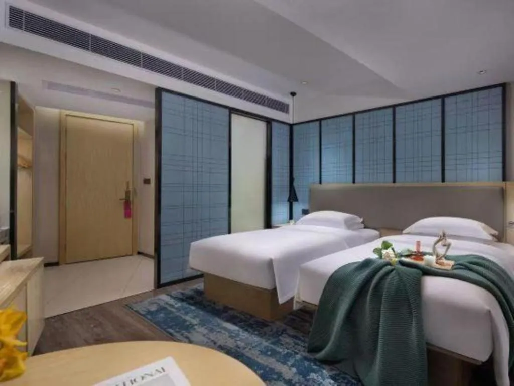 Bed in Echarm Hotel Changsha Wuyi Square Railway Metro Station