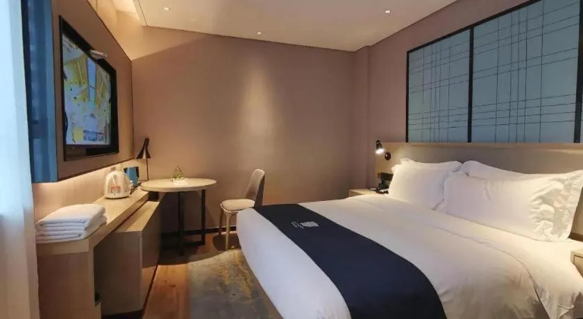 Bed in Echarm Hotel Changsha Wuyi Square Railway Metro Station