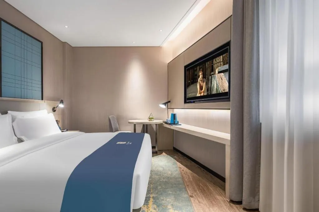 Bed in Echarm Hotel Changsha Wuyi Square Railway Metro Station