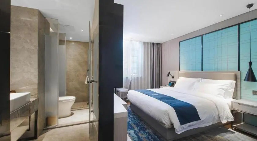 Bed in Echarm Hotel Changsha Wuyi Square Railway Metro Station
