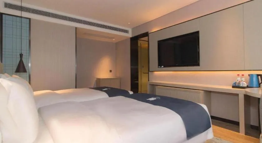 Bed in Echarm Hotel Changsha Wuyi Square Railway Metro Station