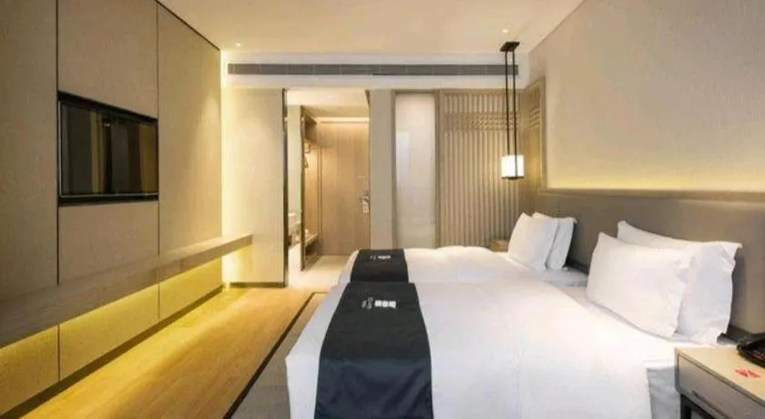 Bed in Echarm Hotel Changsha Wuyi Square Railway Metro Station