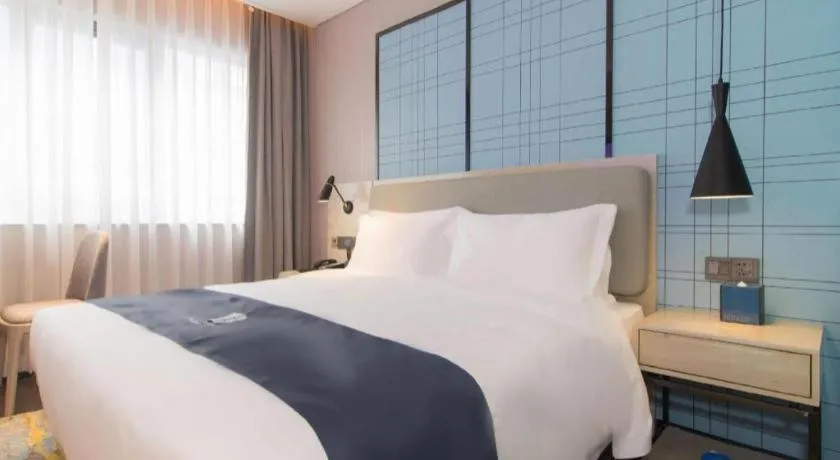 Bed in Echarm Hotel Changsha Wuyi Square Railway Metro Station