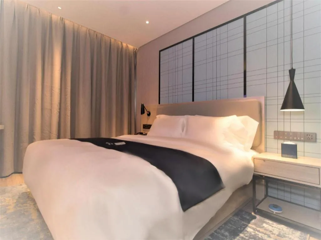 Bed in Echarm Hotel Changsha Wuyi Square Railway Metro Station