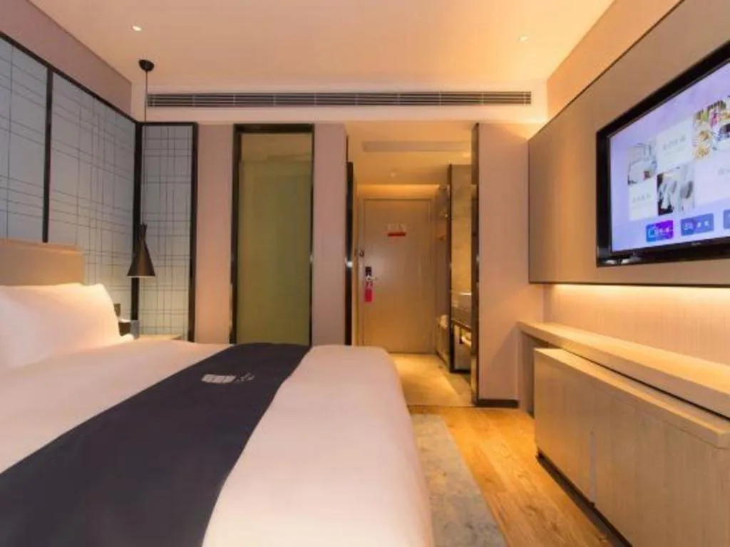 Bed in Echarm Hotel Changsha Wuyi Square Railway Metro Station