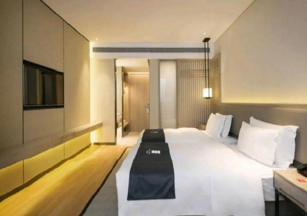Bed in Echarm Hotel Changsha Wuyi Square Railway Metro Station