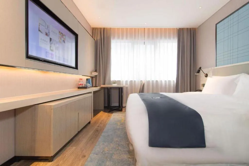 Bed in Echarm Hotel Changsha Wuyi Square Railway Metro Station