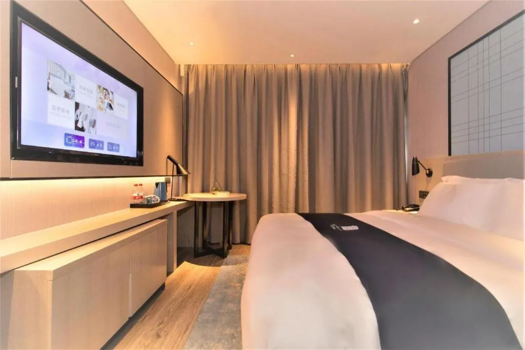 Bed in Echarm Hotel Changsha Wuyi Square Railway Metro Station