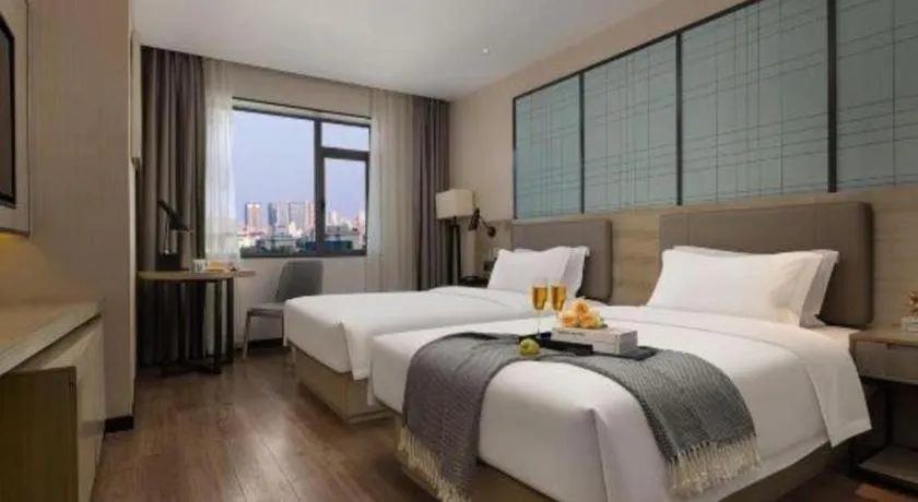 Bed in Echarm Hotel Changsha Wuyi Square Railway Metro Station