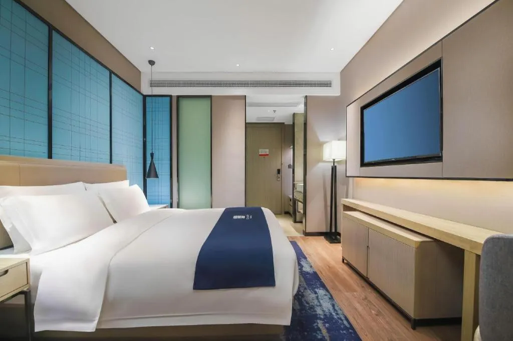Bed in Echarm Hotel Changsha Wuyi Square Railway Metro Station