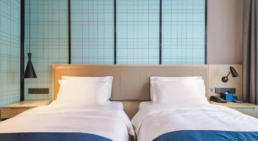 Bed in Echarm Hotel Changsha Wuyi Square Railway Metro Station