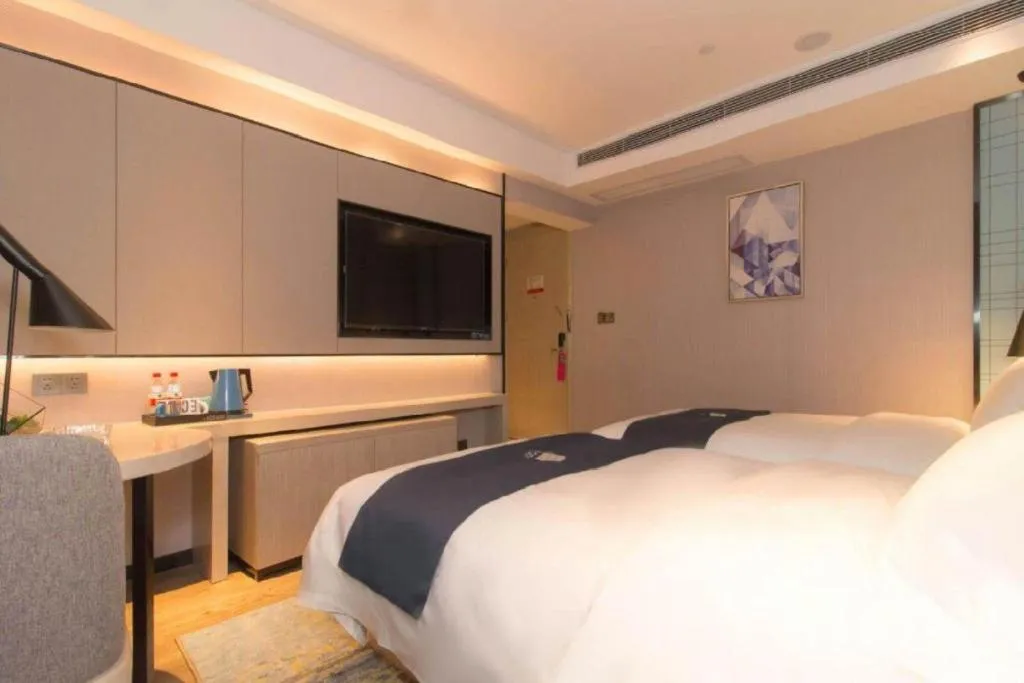Bed in Echarm Hotel Changsha Wuyi Square Railway Metro Station