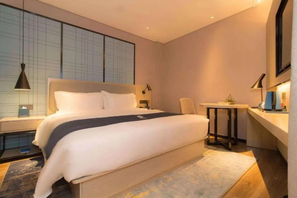 Bed in Echarm Hotel Changsha Wuyi Square Railway Metro Station