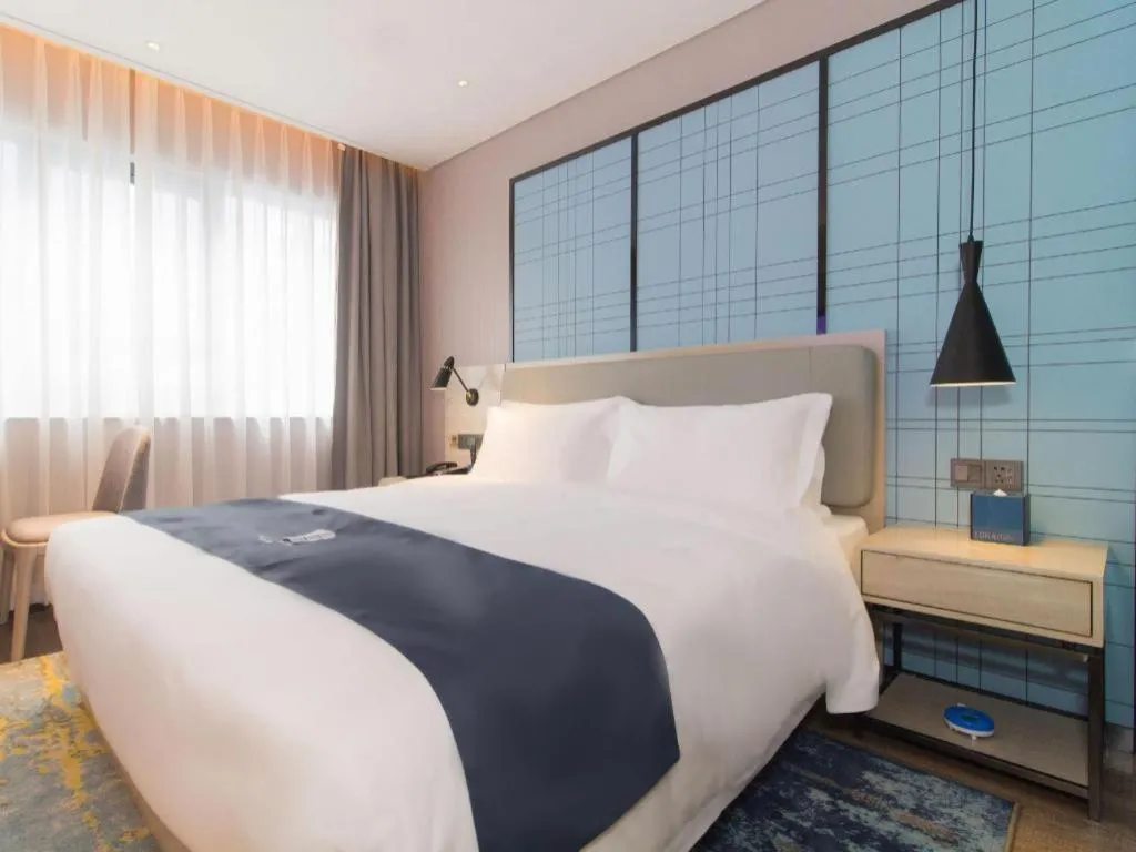 Bed in Echarm Hotel Changsha Wuyi Square Railway Metro Station