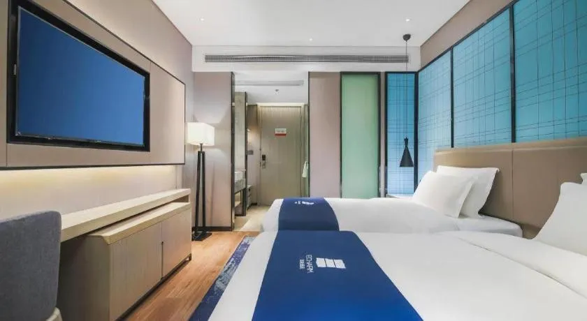 Bed in Echarm Hotel Changsha Wuyi Square Railway Metro Station