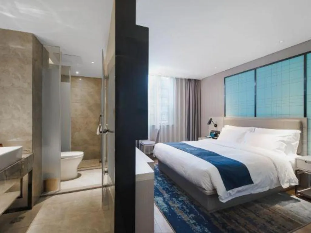 Bed in Echarm Hotel Changsha Wuyi Square Railway Metro Station