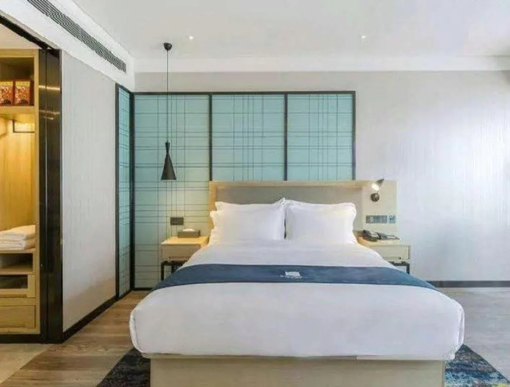 Bed in Echarm Hotel Changsha Wuyi Square Railway Metro Station