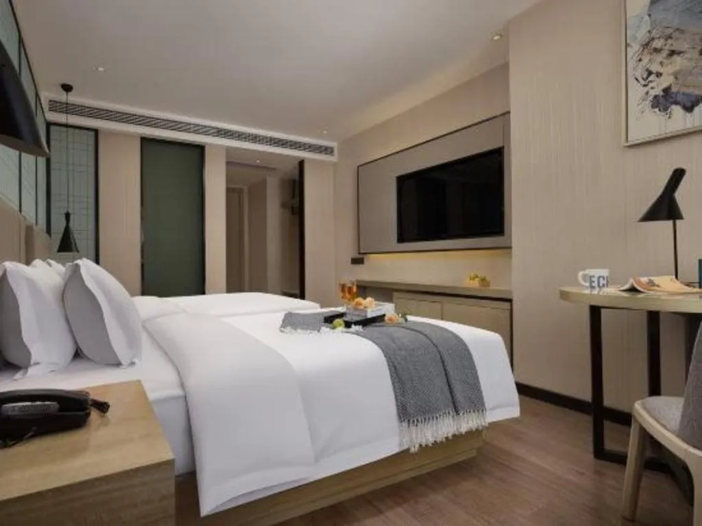 Bed in Echarm Hotel Changsha Wuyi Square Railway Metro Station