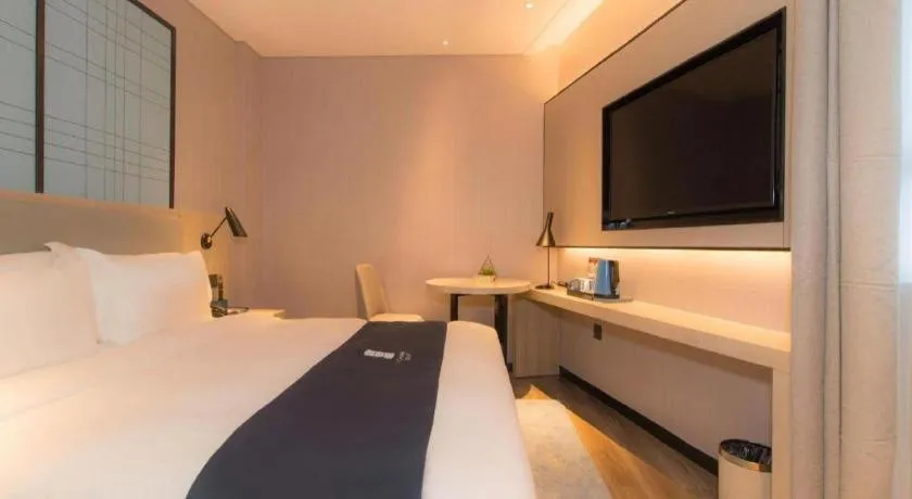 Bed in Echarm Hotel Changsha Wuyi Square Railway Metro Station