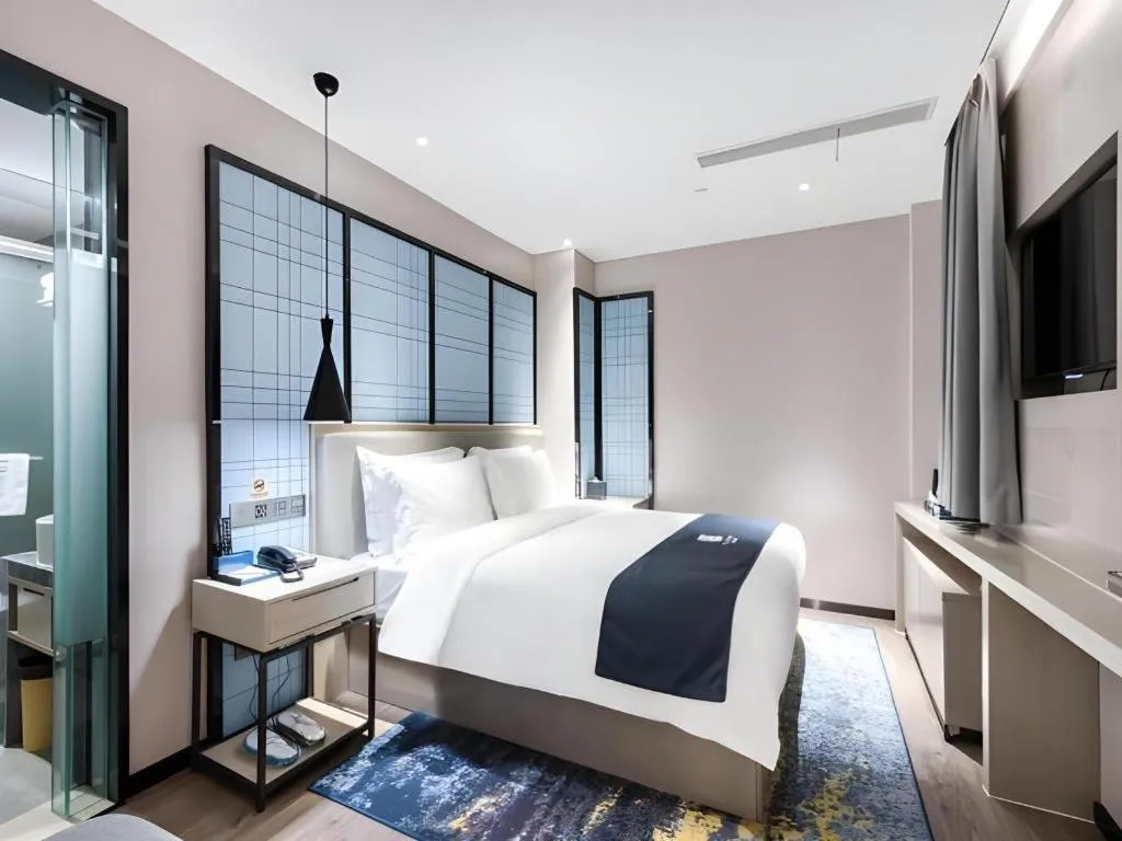 Bed in Echarm Hotel Huzhou Wuyue Plaza Children's Clothing City