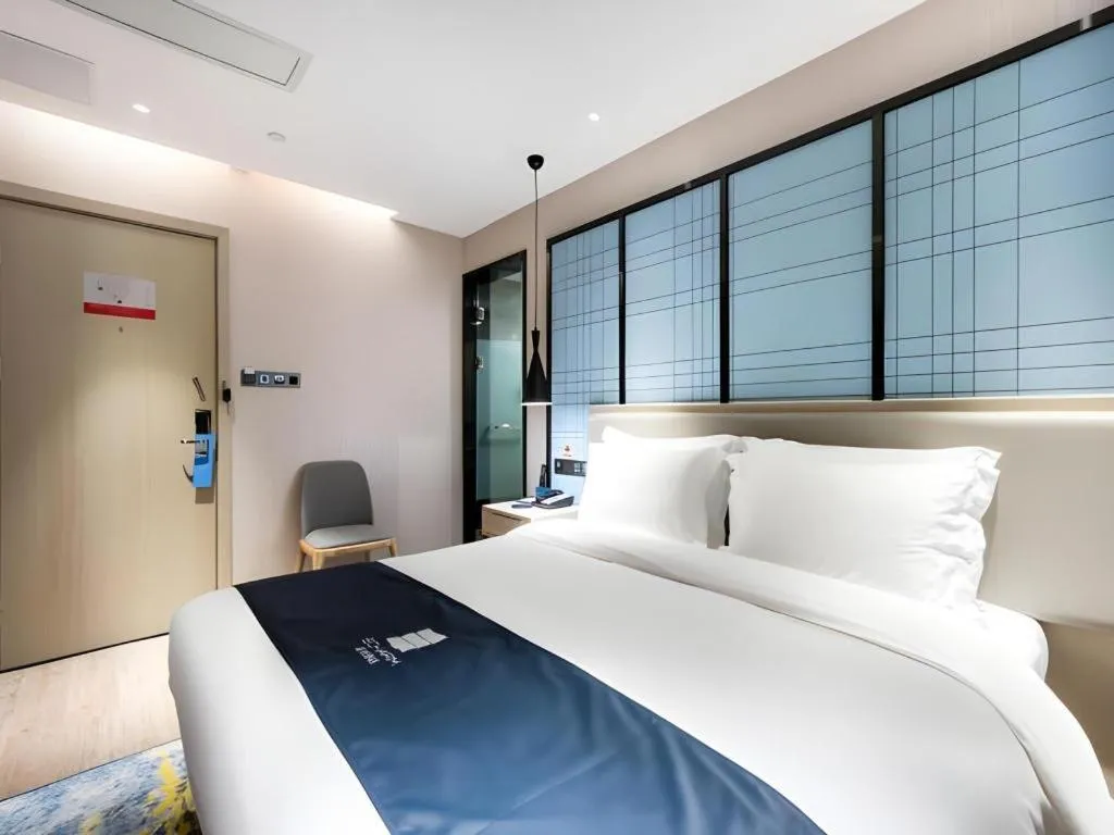 Bed in Echarm Hotel Huzhou Wuyue Plaza Children's Clothing City