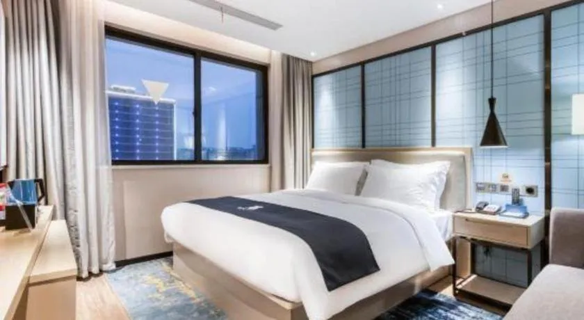 Bed in Echarm Hotel Huzhou Wuyue Plaza Children's Clothing City