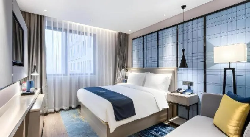 Bed in Echarm Hotel Huzhou Wuyue Plaza Children's Clothing City