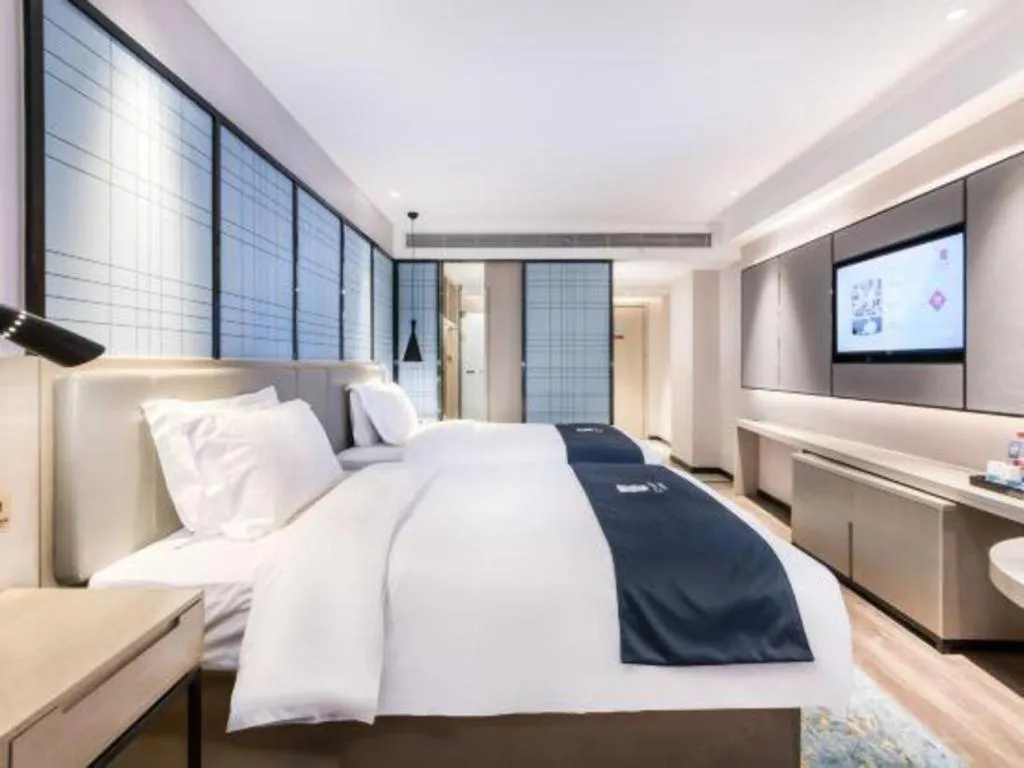 Bed in Echarm Hotel Huzhou Wuyue Plaza Children's Clothing City
