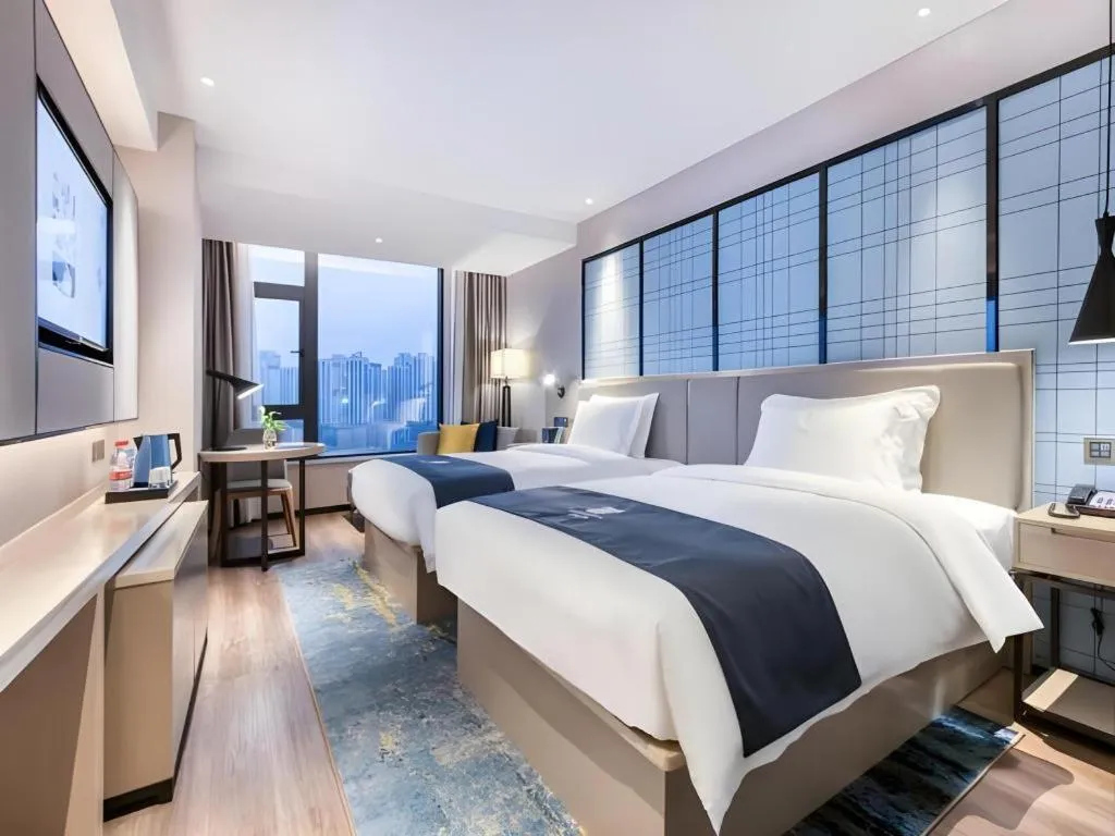 Bed in Echarm Hotel Huzhou Wuyue Plaza Children's Clothing City