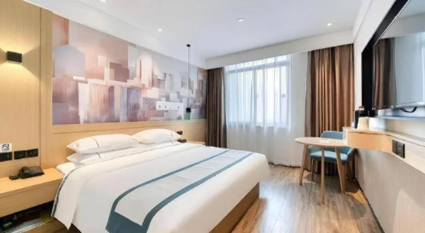 Bed in City Comfort Inn Kunming Flower City Midea Shuncheng Mansion