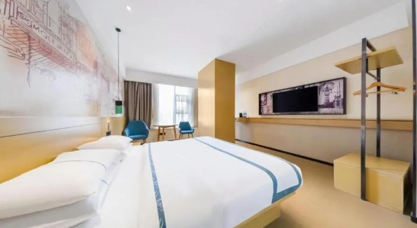 Bed in City Comfort Inn Kunming Flower City Midea Shuncheng Mansion