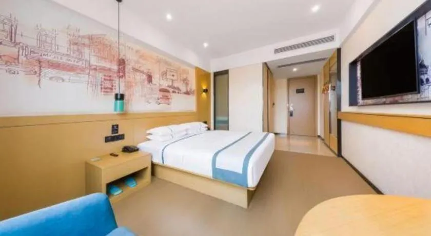 Bed in City Comfort Inn Kunming Flower City Midea Shuncheng Mansion