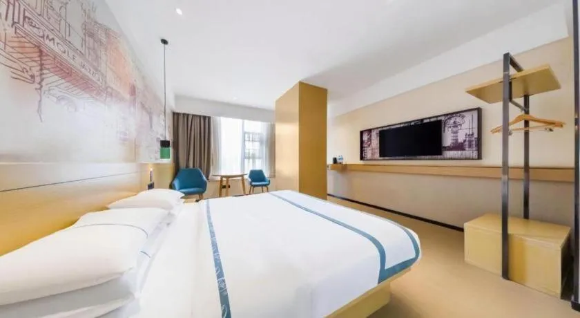 Bed in City Comfort Inn Kunming Flower City Midea Shuncheng Mansion