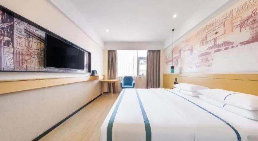 Bed in City Comfort Inn Kunming Flower City Midea Shuncheng Mansion