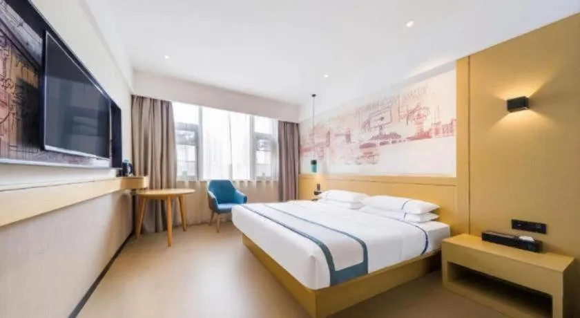 Bed in City Comfort Inn Kunming Flower City Midea Shuncheng Mansion