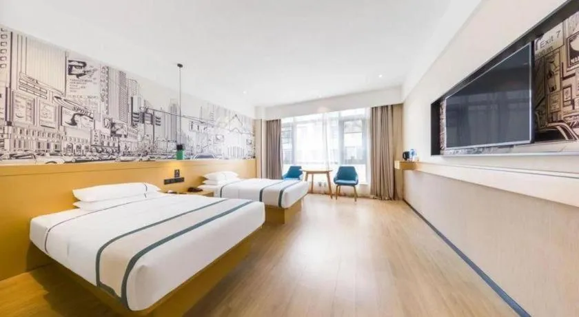 Bed in City Comfort Inn Kunming Flower City Midea Shuncheng Mansion