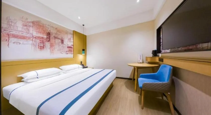 Bed in City Comfort Inn Kunming Flower City Midea Shuncheng Mansion