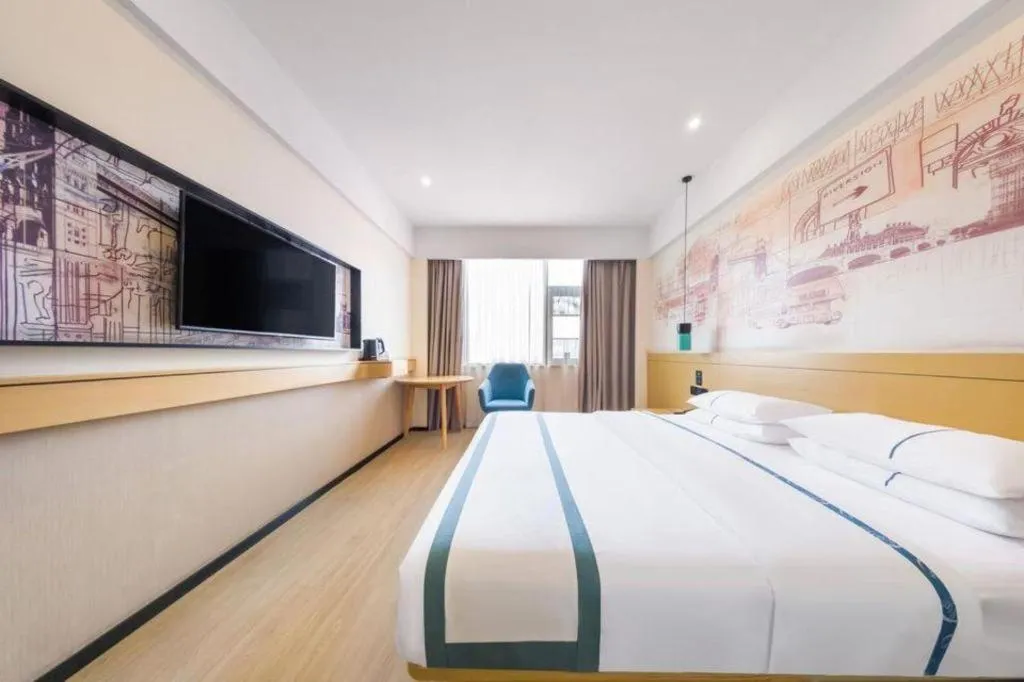 Bed in City Comfort Inn Kunming Flower City Midea Shuncheng Mansion