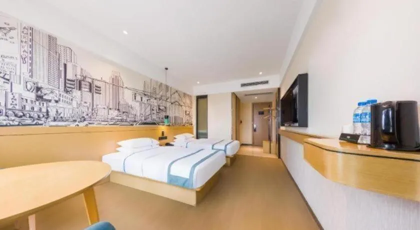 Bed in City Comfort Inn Kunming Flower City Midea Shuncheng Mansion