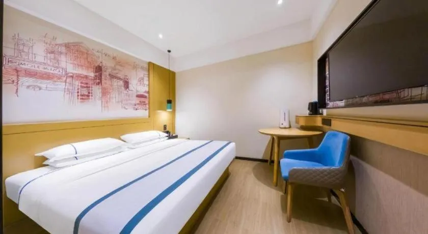 Bed in City Comfort Inn Kunming Flower City Midea Shuncheng Mansion