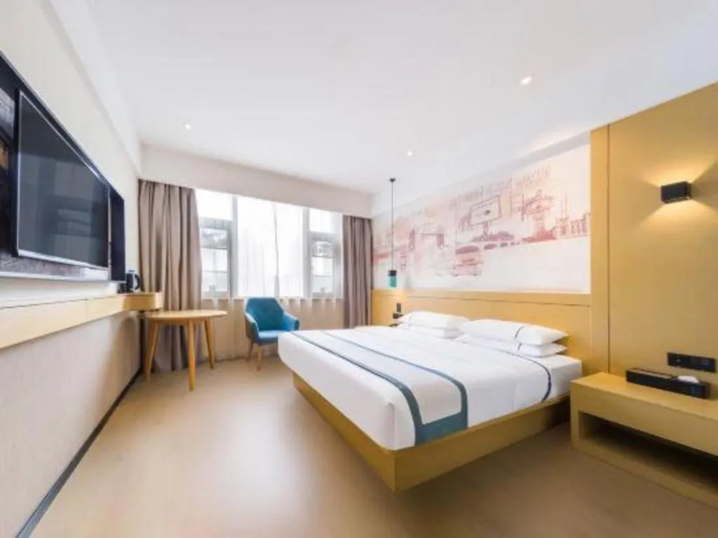 Bed in City Comfort Inn Kunming Flower City Midea Shuncheng Mansion