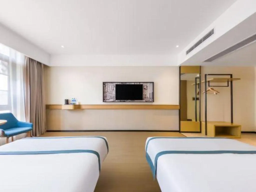 Bed in City Comfort Inn Kunming Flower City Midea Shuncheng Mansion