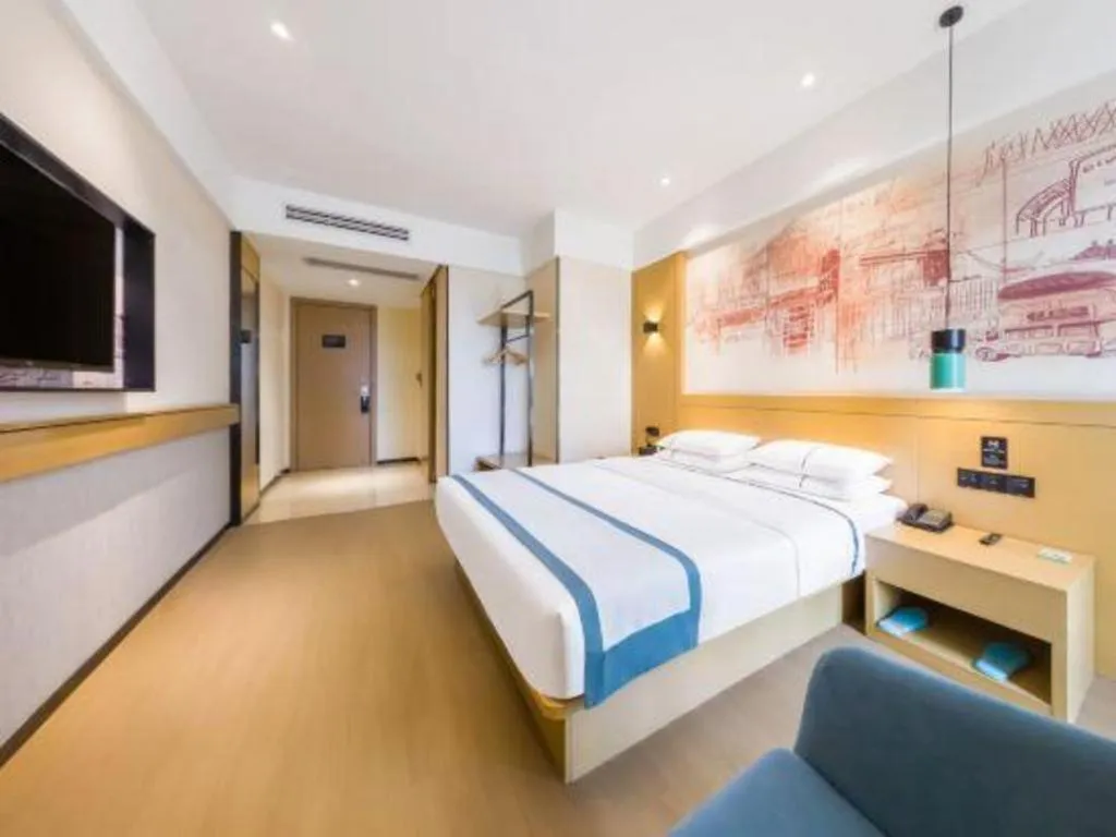 Bed in City Comfort Inn Kunming Flower City Midea Shuncheng Mansion