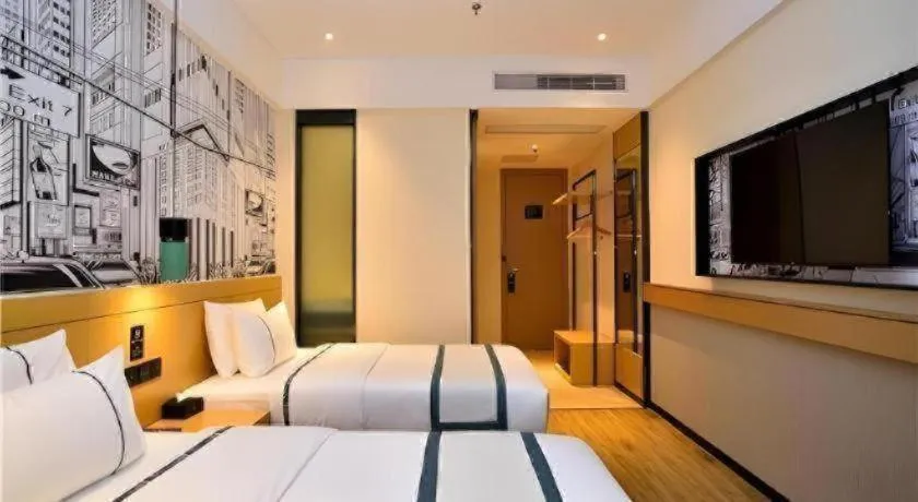 Bed in City Comfort Inn Kunming Flower City Midea Shuncheng Mansion