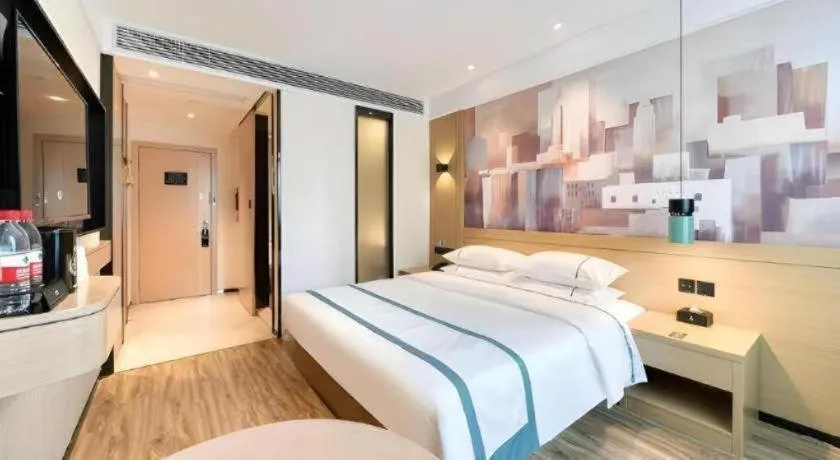 Bed in City Comfort Inn Kunming Flower City Midea Shuncheng Mansion