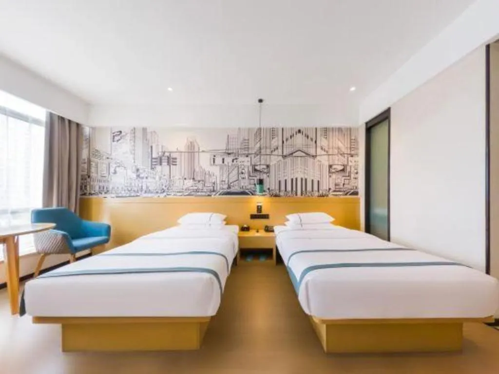 Bed in City Comfort Inn Kunming Flower City Midea Shuncheng Mansion